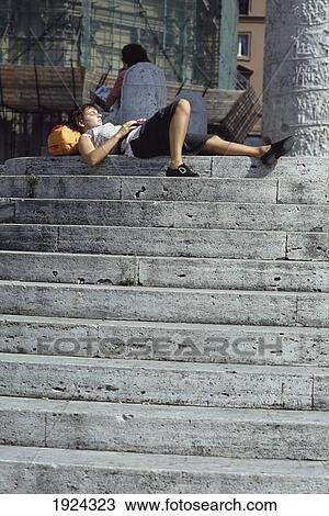 Stock Image - Relaxing Beside Trajan's Column. Fotosearch