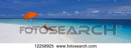 Stock Photography - Relaxing on remote Marshall Islands beach; Marshall Islands. Fotosearch