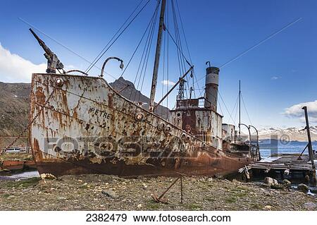 Stock Photo - Relic ships at the old whaling station of Grytviken, South Georgia Island; Svalbard, Norway. Fotosearch