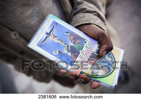 Stock Photograph - Religious cards for sale depicting assorted saints; Ethiopia. Fotosearch