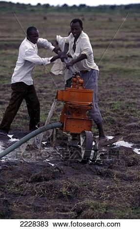 Removing Water By Hand Pump From A New Well, Nyangwi Village, Nr Mwanza, Tanzania View Large Photo Image Stock Image - Removing Water By Hand Pump From A New Well, Nyangwi Village, Nr Mwanza, Tanzania. Fotosearch