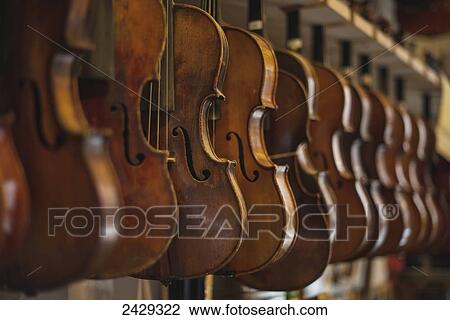Repaired violins and violas on racks in The Sound Post repair shop; Toronto, Ontario, Canada View Large Photo Image Stock Image - Repaired violins and violas on racks in The Sound Post repair shop; Toronto, Ontario, Canada. Fotosearch