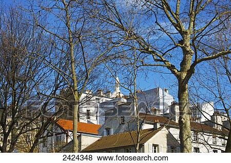 Stock Photo - Residential buildings and a blue sky; Paris, France. Fotosearch