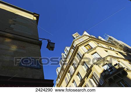 Residential buildings and blue sky in Marais district; Paris, France View Large Photo Image Stock Image - Residential buildings and blue sky in Marais district; Paris, France. Fotosearch