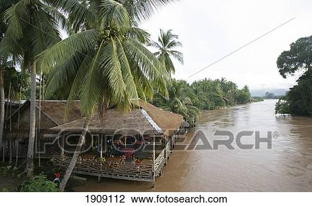 Stock Image - Restaurant On Don Khon Island On Mekong River, Si Phan Don, Champasak Province, Laos. Fotosearch