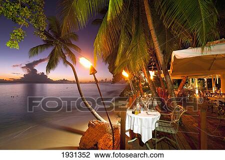 Stock Image - Restaurant On The Beach In Barbados; Barbados. Fotosearch