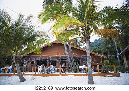 Restaurant on the white sand beach; Ko Phangan, Thailand View Large Photo Image Stock Photo - Restaurant on the white sand beach; Ko Phangan, Thailand. Fotosearch