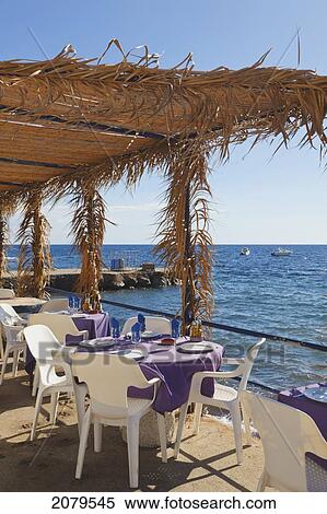 Restaurant Terrace Overlooking Sea At La Isleta Del Moro Also Known As La Isleta In Cabo De Gata-Nijar Natural Park; Almeria Province Spain View Large Photo Image Stock Photography - Restaurant Terrace Overlooking Sea At La Isleta Del Moro Also Known As La Isleta In Cabo De Gata-Nijar Natural Park; Almeria Province Spain. Fotosearch