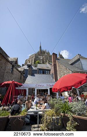 Stock Image - Restaurant terrace within Mont Saint Michel, Normandy, France. Fotosearch