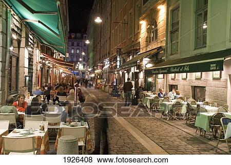 Stock Photo - Restaurants On Rue Des Marronniers. Fotosearch