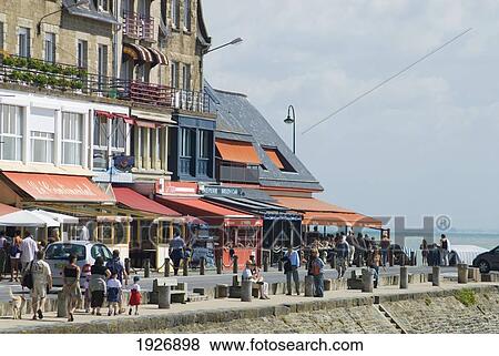 Stock Photo - Restaurants On The Seafront Of Cancale With Mont St Michel Behind, Brittany, France. Fotosearch
