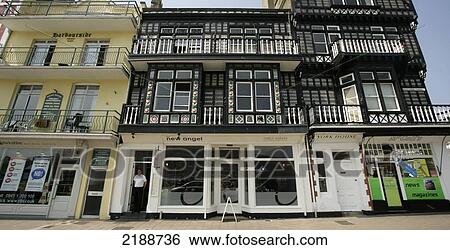 Stock Photograph - Retail shops with residential areas above; Dartmouth, Devon, England. Fotosearch