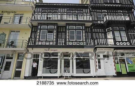Stock Photography - Retail shops with residential areas above; Dartmouth, Devon, England. Fotosearch