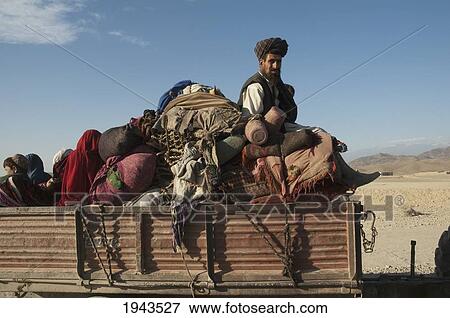 Returned Afghan Refugee With His Chattel On A Truck On The Torkham To Jalalabad Road, Nangarhar Province, Afghanistan View Large Photo Image Stock Photo - Returned Afghan Refugee With His Chattel On A Truck On The Torkham To Jalalabad Road, Nangarhar Province, Afghanistan. Fotosearch
