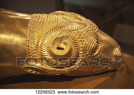 Stock Image - Rhyton drinking vessel in shape of ram's head, Median period, Reza Abbasi Museum; Tehran, Iran. Fotosearch