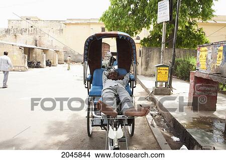 Picture - Rickshaw Driver Takes A Rest, Jaipur, Rajasthan, India. Fotosearch