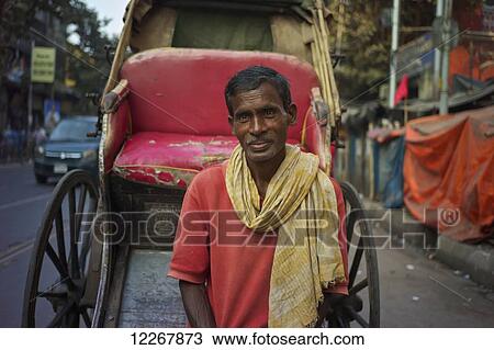 Stock Image - Rickshaw puller; Kolkata, West Bengal, India. Fotosearch