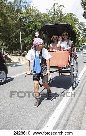 Stock Image - Rickshaw puller; Nara, Japan. Fotosearch