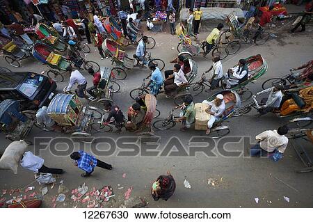 Stock Image - Rickshaws in Dhaka Old City; Dhaka, Bangladesh. Fotosearch