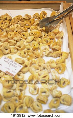 Stock Image - Ricotta Tortellini For Sale In A Deli. Fotosearch