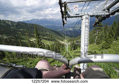 Picture - Riding a ski lift in summer; British Columbia, Canada. Fotosearch