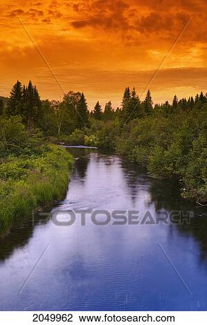 Stock Image - Rimouski River At Sunset, Rimouski Wildlife Reserve, Bas-Saint-Laurent Region, Quebec. Fotosearch
