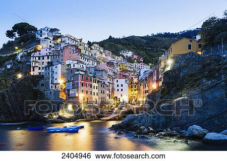 Stock Photograph - Riomaggiore at dawn, Cinque Terre; Liguria, Italy. Fotosearch