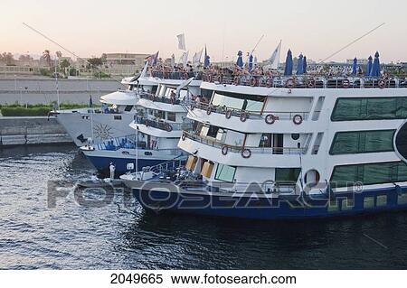 Stock Photography - River Cruise Boats By The Esna Locks On The Nile River, Qina, Egypt. Fotosearch