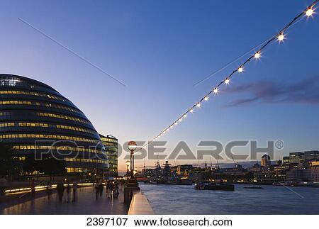 Stock Photo - River Thames, GLA City Hall Building and City of London at dusk; London, England. Fotosearch
