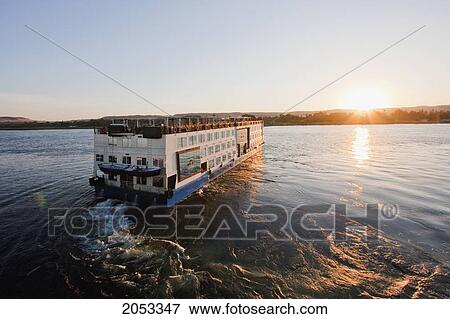 Stock Photo - Riverboat Ms Tu-Ya On The Nile River At Sunset, Aswan, Egypt. Fotosearch