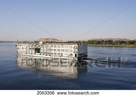 Stock Photograph - Riverboat Ms Tu-Ya On The Nile River At Sunset, Aswan, Egypt. Fotosearch