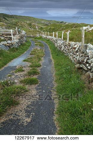 Road and stone wall on Inishturk Island, Wild Atlantic Way; County Mayo, Ireland View Large Photo Image Stock Photo - Road and stone wall on Inishturk Island, Wild Atlantic Way; County Mayo, Ireland. Fotosearch