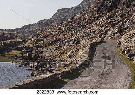 Road through Gap of Dunloe; Iveragh Peninsula, County Kerry, Ireland, UK View Large Photo Image Stock Image - Road through Gap of Dunloe; Iveragh Peninsula, County Kerry, Ireland, UK. Fotosearch