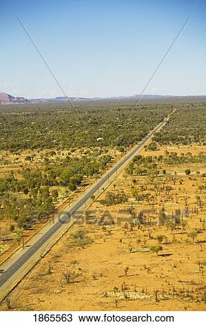 Stock Image - Road Through Outback In Alice Springs, Northern Territories, Australia. Fotosearch