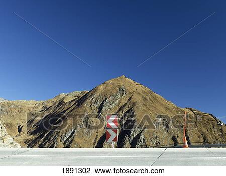 Stock Image - Road With Mountain Peak In Background. Fotosearch