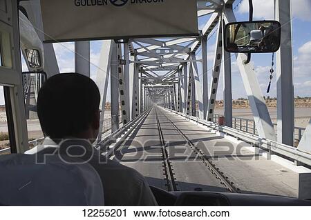 Stock Image - Road/rail bridge crossing Amu Darya (Oxus) river, near Turtkul, Kizilkum desert; Khwarezm region, Uzbekistan. Fotosearch