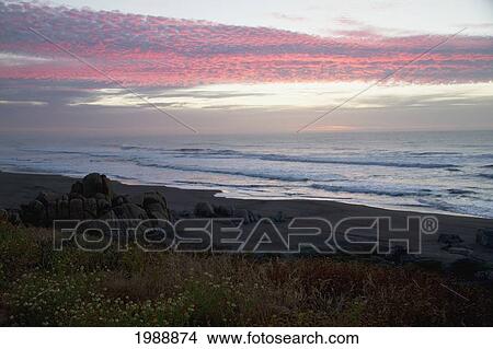 Picture - Rocas De Santo Domingo Beach At Sunset, Santo Domingo, Chile. Fotosearch