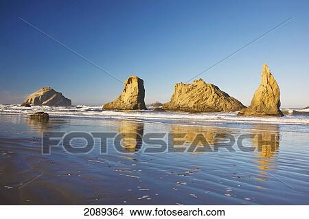 Picture - Rock Formations At Low Tide On Bandon Beach; Oregon, United States Of America. Fotosearch