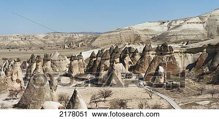 Rock Formations On A Landscape And A Blue Sky; Nevsehir Turkey View Large Photo Image Stock Image - Rock Formations On A Landscape And A Blue Sky; Nevsehir Turkey. Fotosearch