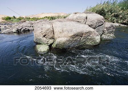 Stock Image - Rocks By The Nile River In The First Cataract Islands Protected Area Saluga And Ghazal, Aswan, Egypt. Fotosearch