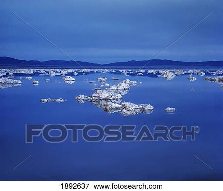 Stock Photo - Rocks In Lake. Fotosearch