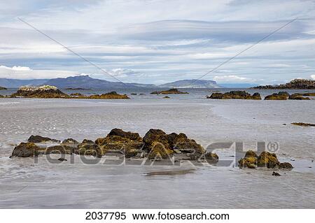 Rocks In The Water Along The Coast; Argyll Scotland View Large Photo Image Stock Photography - Rocks In The Water Along The Coast; Argyll Scotland. Fotosearch