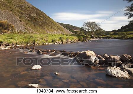 Picture - Rocks Under Clear Water In A River; Ingram Northumberland England. Fotosearch