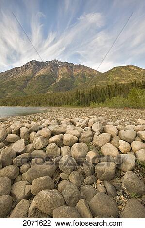 Rocky Beach Beneath The Coast Mountains Of Tagish Lake, Northern British Columbia View Large Photo Image Stock Image - Rocky Beach Beneath The Coast Mountains Of Tagish Lake, Northern British Columbia. Fotosearch