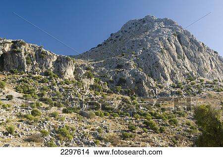 Rocky outcrop above the village of Villaluenga del Rosario in the Parque natural de la Sierra de Grazalema. Andalucia, Spain View Large Photo Image Picture - Rocky outcrop above the village of Villaluenga del Rosario in the Parque natural de la Sierra de Grazalema. Andalucia, Spain. Fotosearch