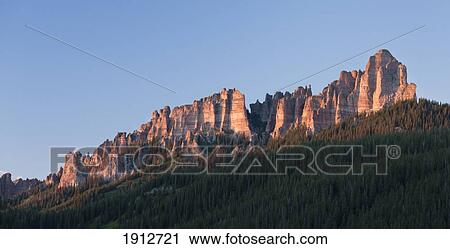 Stock Image - Rocky Spires On Dunsinane Mountain In The San Juan Mountains With The Last Rays Of The Setting Sun; Colorado, United States Of America. Fotosearch