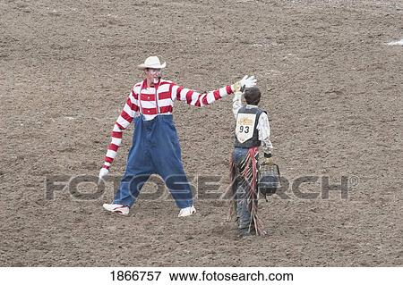 Rodeo Clown And Cowboy, Calgary Stampede Rodeo, Calgary, Alberta, Canada View Large Photo Image Stock Photo - Rodeo Clown And Cowboy, Calgary Stampede Rodeo, Calgary, Alberta, Canada. Fotosearch