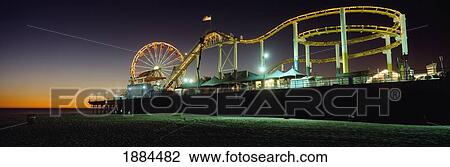 Rollercoaster And Ferris Wheel At Dusk On The Santa Monica Pier View Large Photo Image Stock Image - Rollercoaster And Ferris Wheel At Dusk On The Santa Monica Pier. Fotosearch