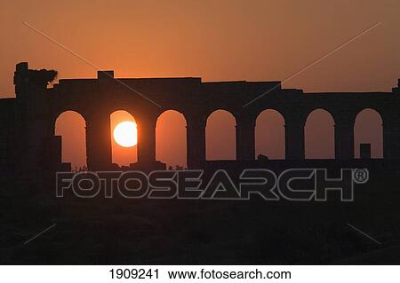 Stock Image - Roman Ruins Of Volubilis At Sunset, Volubilis, Morocco. Fotosearch