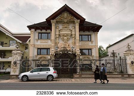 Stock Photograph - Romania, Exterior of kitschy house; Maramures. Fotosearch